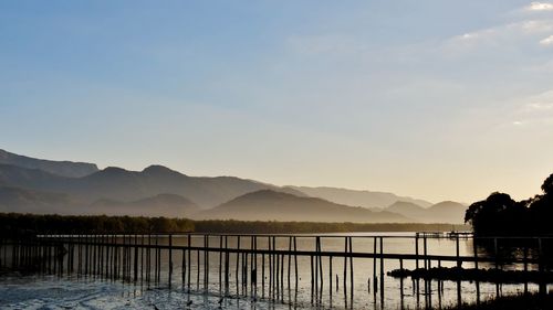 Scenic view of lake and mountains against sky