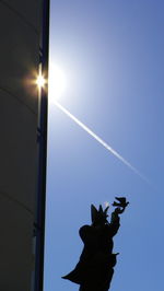 Low angle view of statue against sky