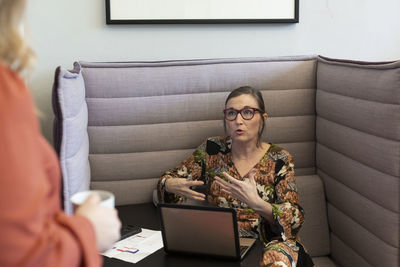 Mature woman talking in office