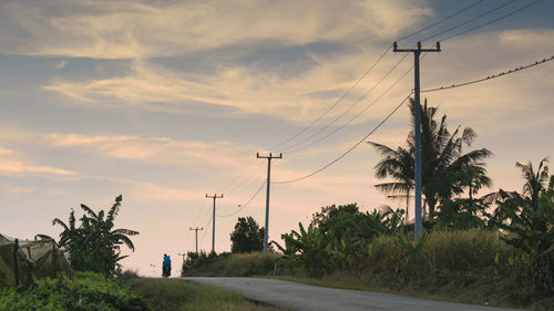 Low angle view of electricity pylon against sky