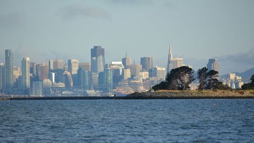 Distant view of city skyline from sea