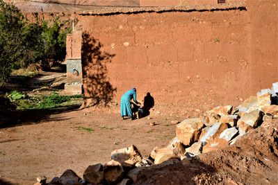 Woman standing against wall