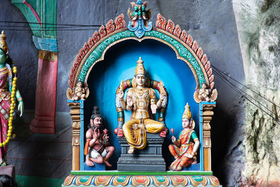 Statue of temple against building