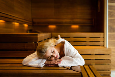 Portrait of woman sleeping on table