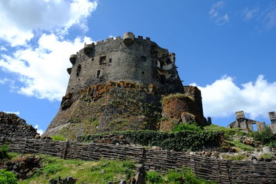 Low angle view of old ruin building against sky