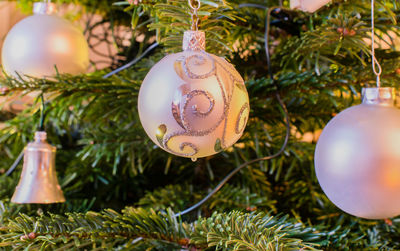 Close-up of christmas ornaments on tree