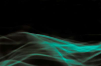 Close-up of light painting against black background