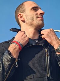 Low angle view of man with tattoo