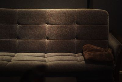 Close-up of sofa in the dark