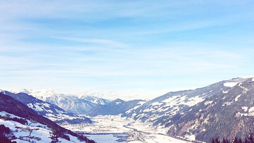 Scenic view of snow covered mountains against sky