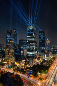 High angle view of illuminated buildings in city at night
