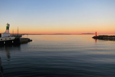 Scenic view of sea against clear sky during sunset