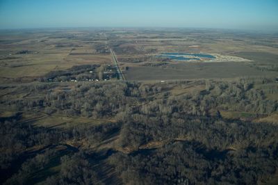 Aerial view of agricultural field against sky