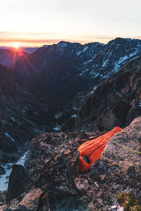 Scenic view of snowcapped mountains against sky during sunset