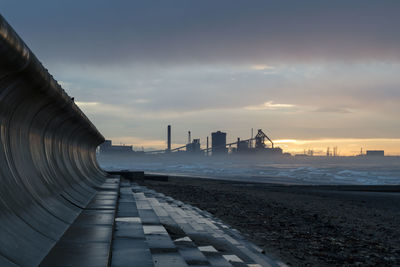 Panoramic view of beach against sky during sunset