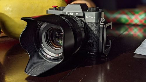 Close-up of camera on table