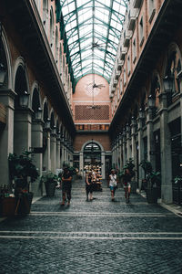 Rear view of man walking on street