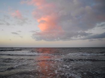 Scenic view of sea against cloudy sky