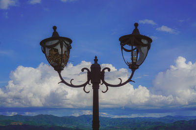 Low angle view of street light against sky