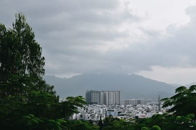 Buildings in city against sky