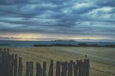 Scenic view of beach against sky during sunset