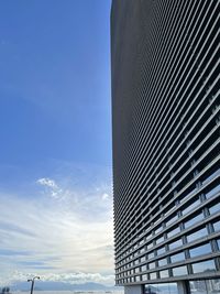 Low angle view of sea against blue sky