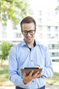 Portrait of young man using mobile phone
