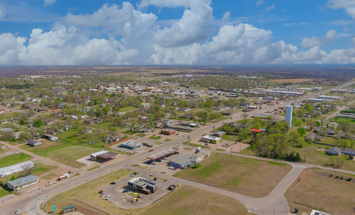 High angle view of cars on field against sky