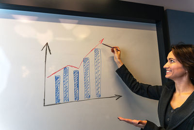 Portrait of young woman working at office