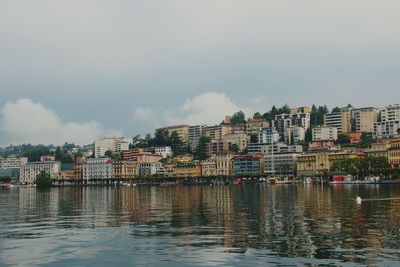 Scenic view of residential buildings on lakeshore