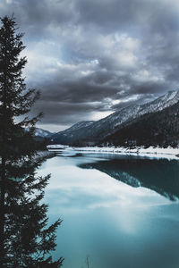 Scenic view of lake and mountains against sky