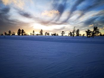 Scenic view of snow covered landscape against sky