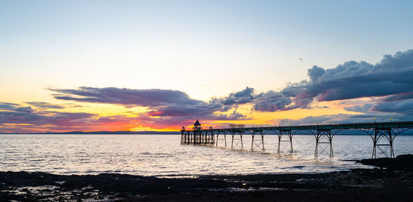 Scenic view of sea against sky during sunset at clevedon pier