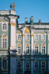 Low angle view of historic building against blue sky