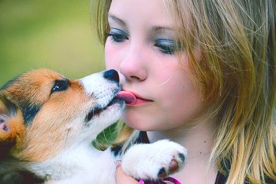 Close-up of girl with dog