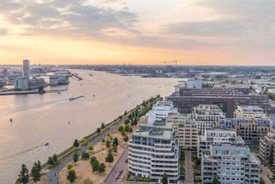 High angle view of buildings against sky in amsterdam during sunset