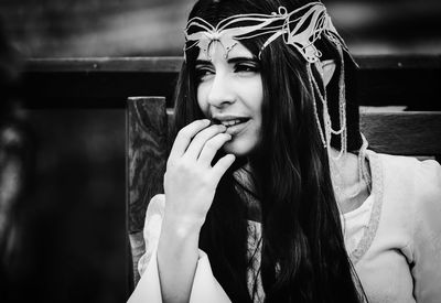 Portrait of beautiful young woman looking away