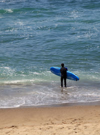 Surfer enjoys the waves of the ocean in southern california in summer