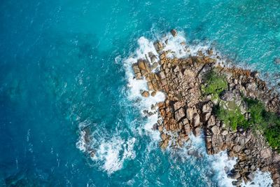 High angle view of rocks in sea