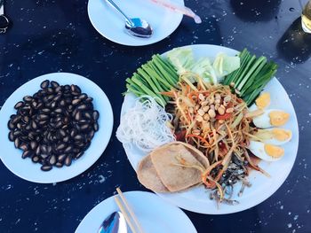 High angle view of food served in plates on table