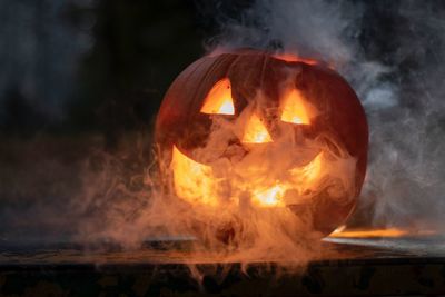 Close-up of fire burning at night