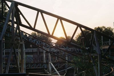 Low angle view of bridge against sky during sunset