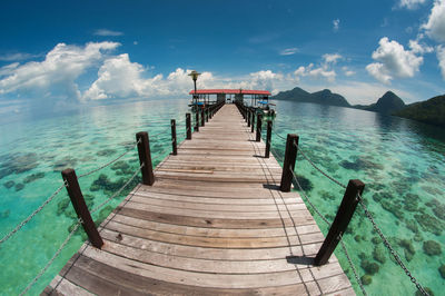 Pier over sea against sky