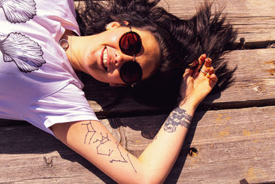 Tattooed young girl in the sunshine 