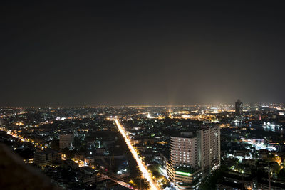 Illuminated buildings in city at night