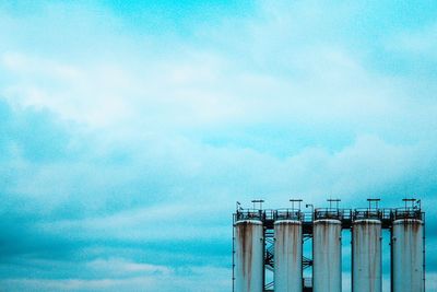 Low angle view of factory against sky