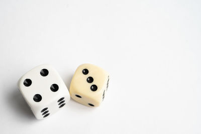 High angle view of coins on white background