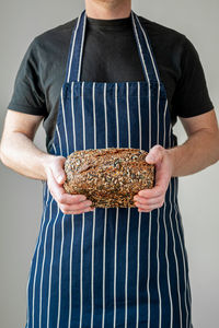 Midsection of man preparing food