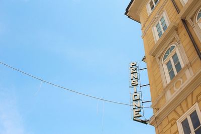 Low angle view of buildings against blue sky