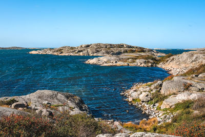 Scenic view of sea against clear blue sky